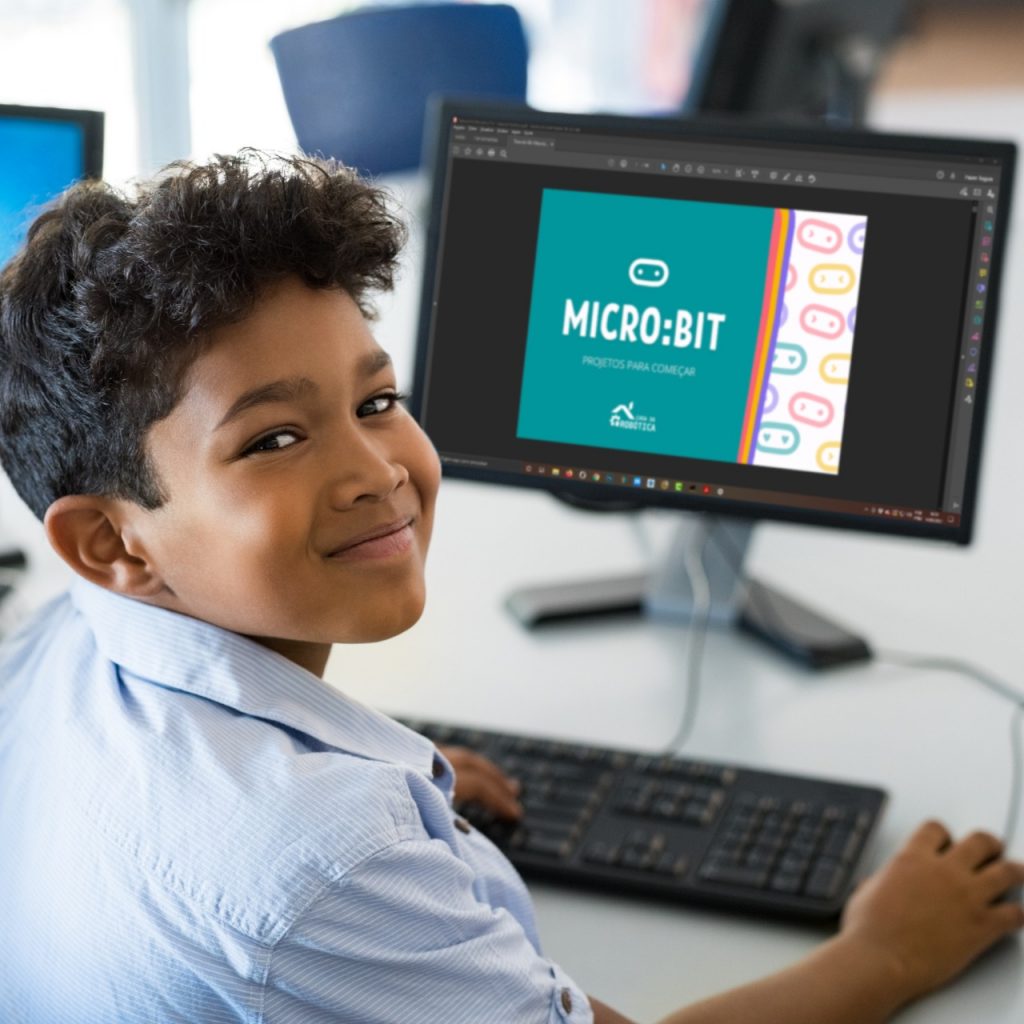 Imagem ilustrativa de menino no computador.